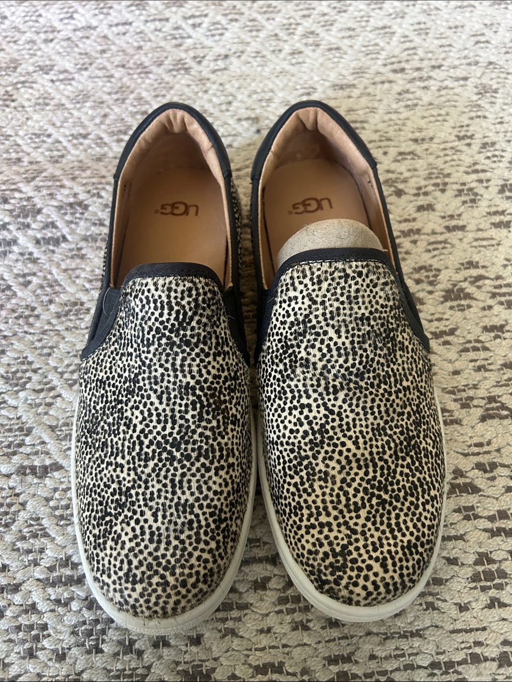 UGG Black and Cream leather pony hair slip on sneakers